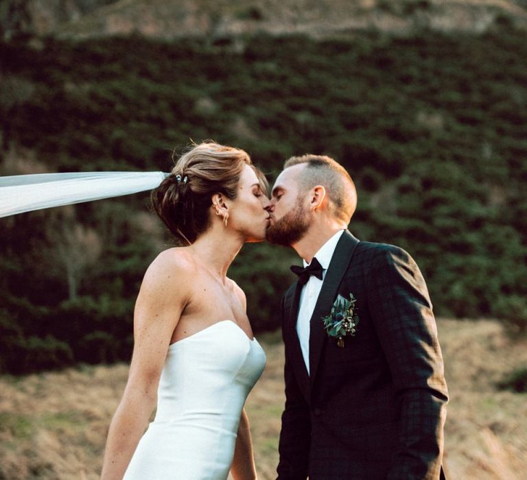 Bride and groom kissing at Edinburgh elopement