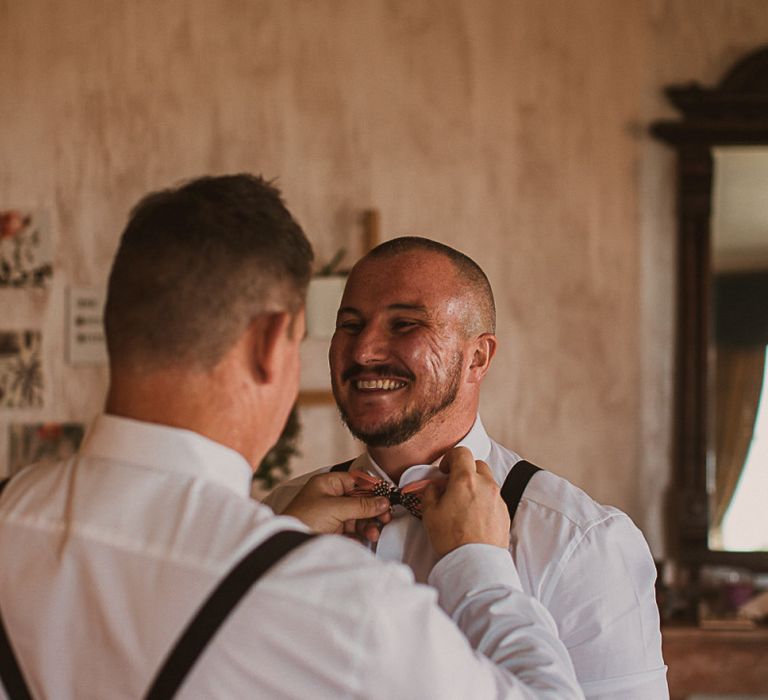 Groomsmen on the Wedding Morning in Braces and Bow Ties featured on escape to the chateau