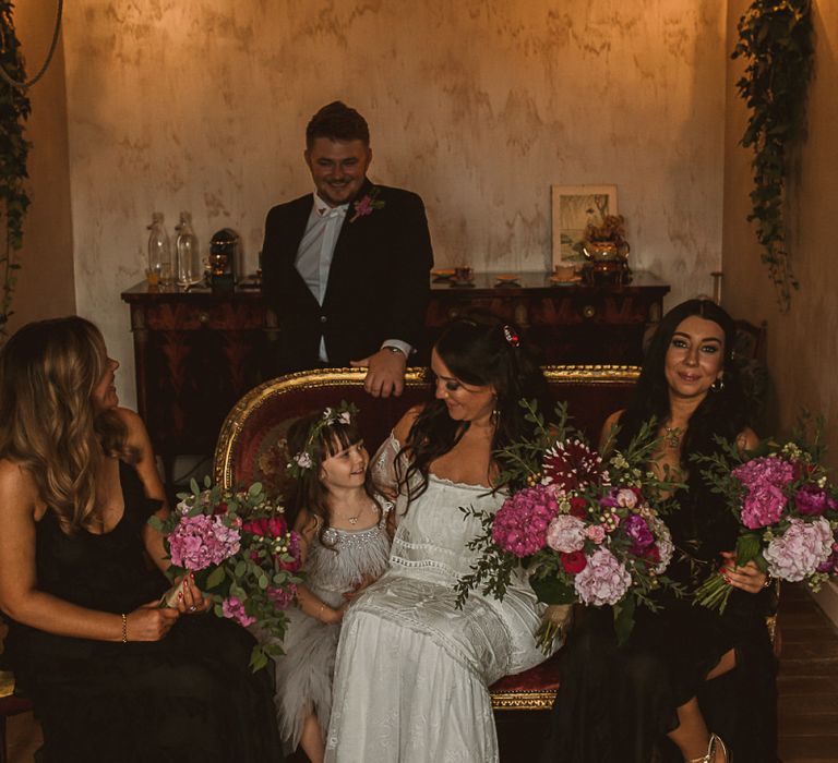 Bridal Party on the Wedding Morning with Bride in Emanuela Grace Loves Lace Off The Shoulder Wedding Dress, Bridesmaids in Black Dress and Young Daughter in a Tutu