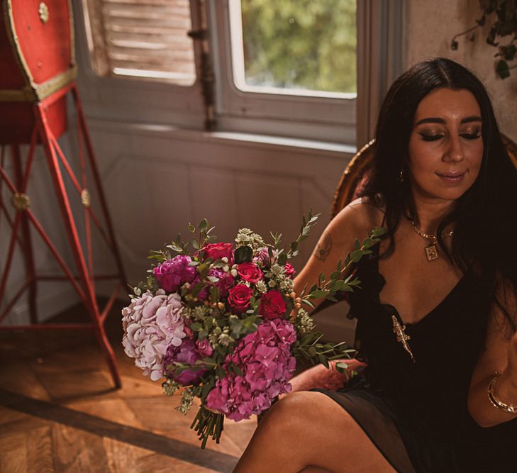 Bridesmaid Holding a Pink Rose and Hydrangea Wedding Bouquet featured on escape to the chateau