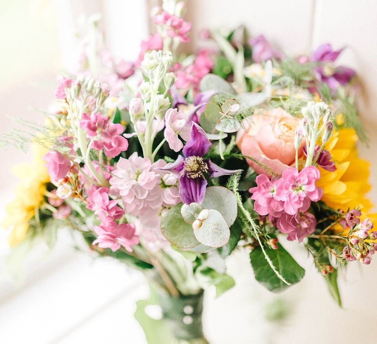 Bright Bridal Bouquet with Sunflowers | Colourful Paper Cranes &amp; Sunflower Wedding Décor in Rustic Barn | Sarah-Jane Ethan Photography