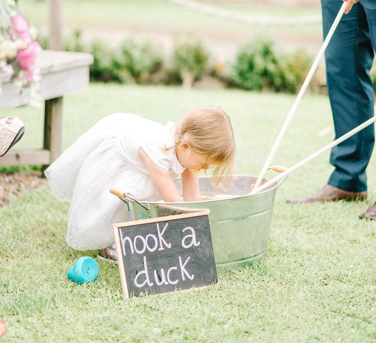 Hook a Duck Vintage Game at Wedding Reception | Colourful Paper Cranes &amp; Sunflower Wedding Décor in Rustic Barn | Sarah-Jane Ethan Photography