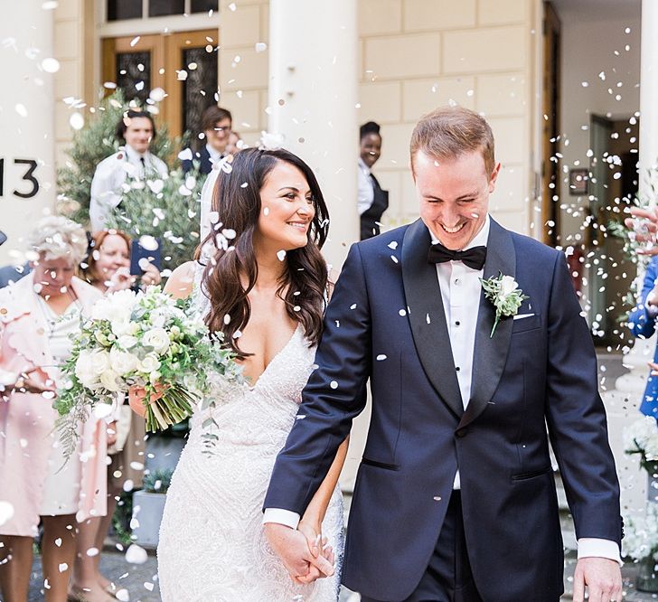 Confetti Exit | Bride in Bespoke Wedding Dress | Groom in Oscar Hunt Tuxedo | Elegant White, Green &amp; Gold Wedding with Succulent &amp; Foliage Decor at ICA in London City | Kylee Yee Fine Art Photography