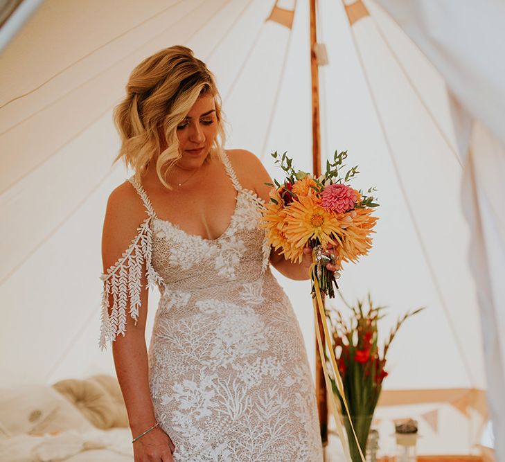 Bride in Grace Loves Lace wedding dress with bright bouquet