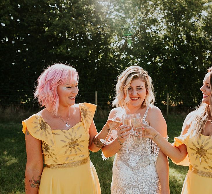 Canary yellow bridesmaid dresses with bright bouquets