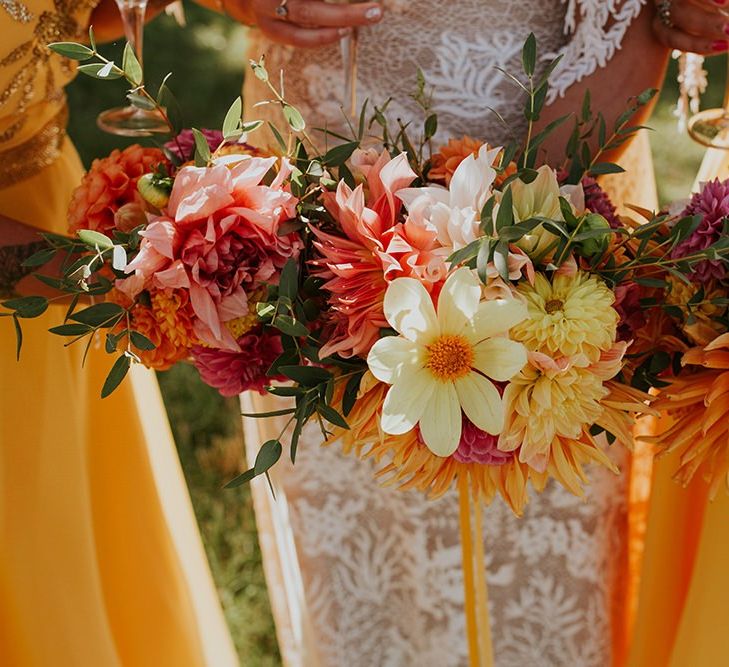 Canary yellow bridesmaid dresses with bright bouquets