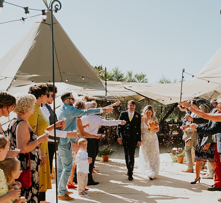 Confetti exit for bride and groom outside PapaKata tipi