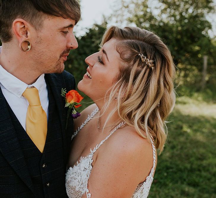 Bride and groom take a moment to themselves during festival style wedding