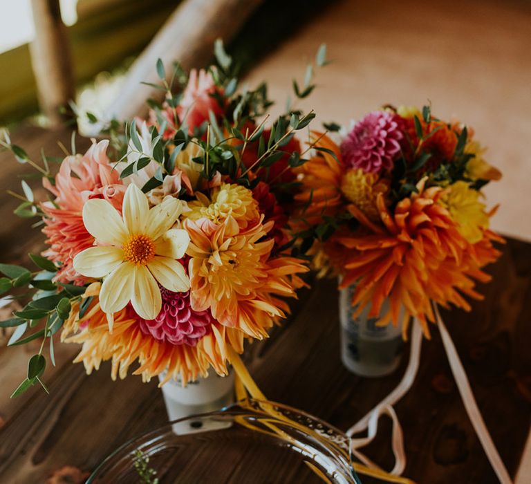 Bright wedding flowers to match canary yellow bridesmaid dresses and bright decor