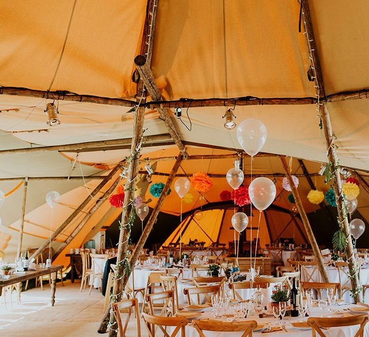 Wedding balloon centrepieces with multi-coloured pompom decor