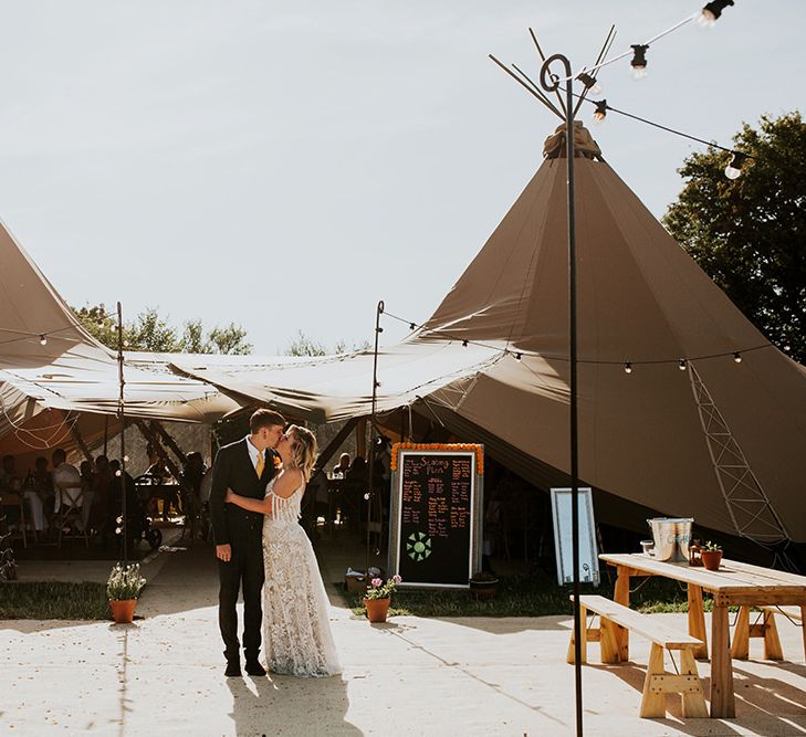 PapaKata tipi at festival style wedding with canary yellow bridesmaid dresses