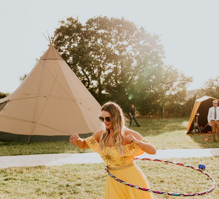 Canary yellow bridesmaid dresses and garden games at wedding