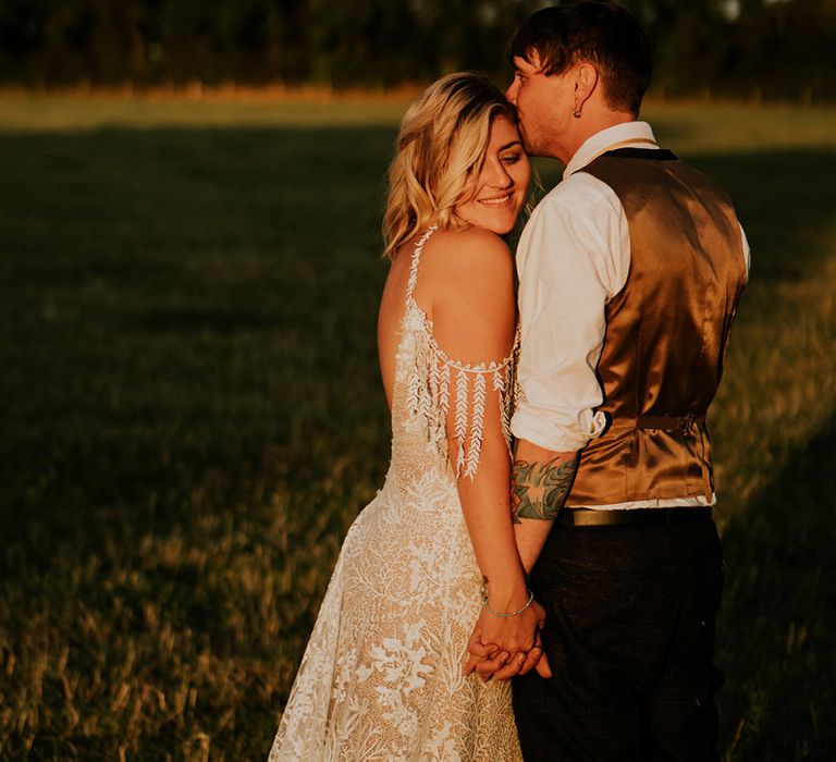 Groom in waistcoat at festival style celebration