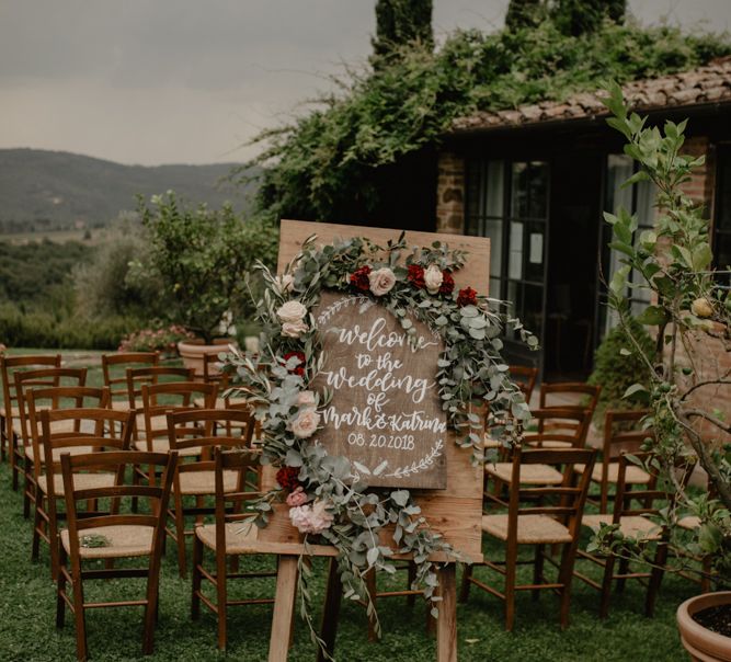 Wooden Welcome Sign on an Easel at Outdoor Ceremony