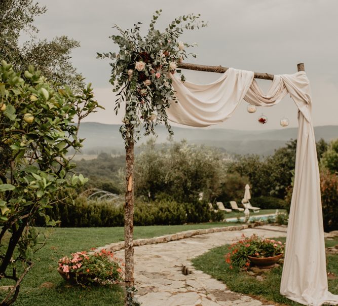 Draped Wooden Altar with Flower Decor