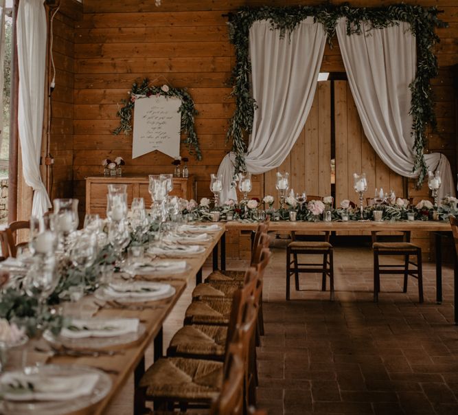 Rustic Wedding Reception Decor with Fairy Lights and Drapes