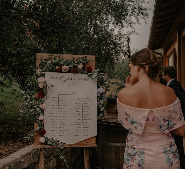 Wooden Seating Chart with Floral Garland Wedding Decor