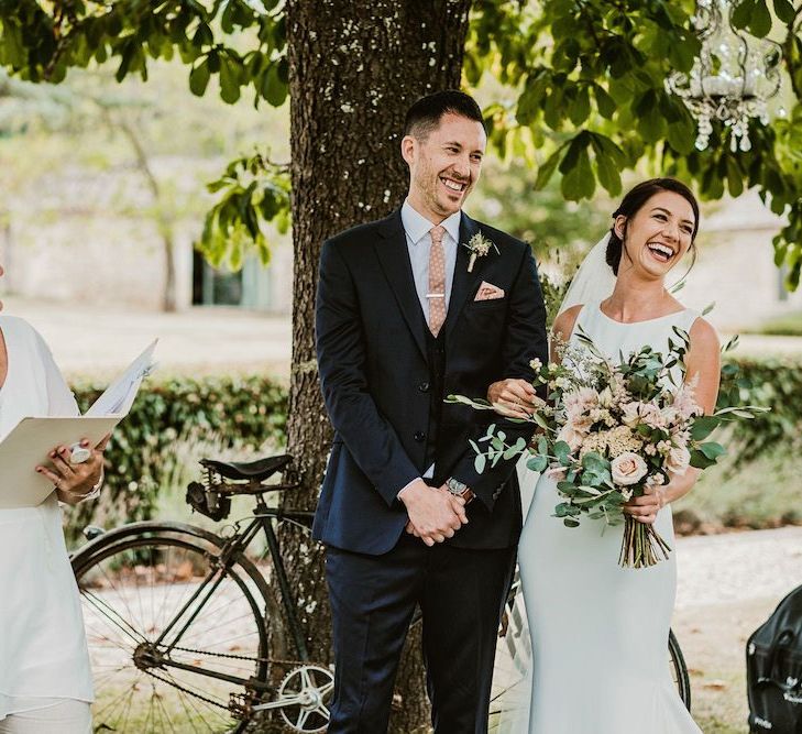 Bride and groom at outdoor wedding ceremony