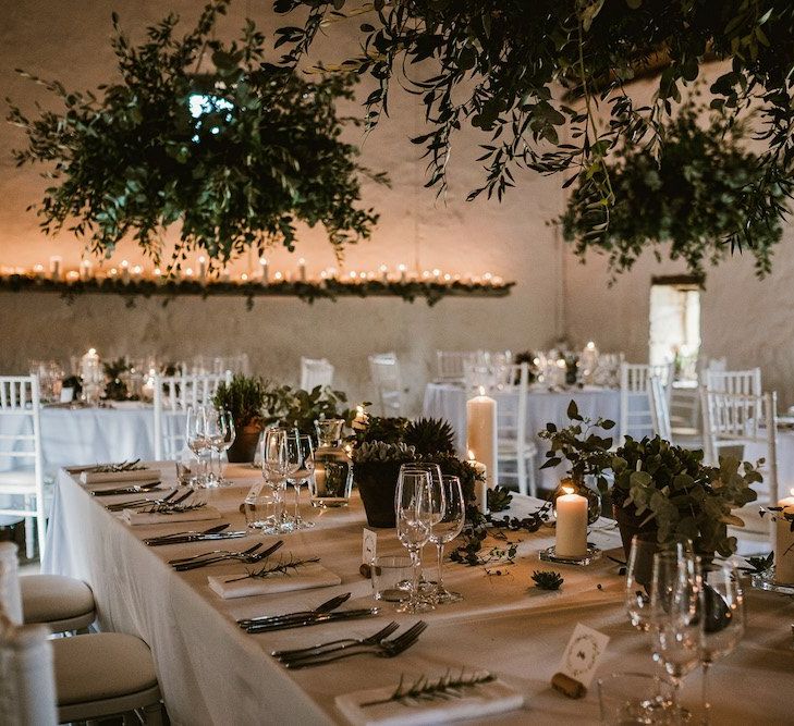 Foliage chandeliers and candle lit tables