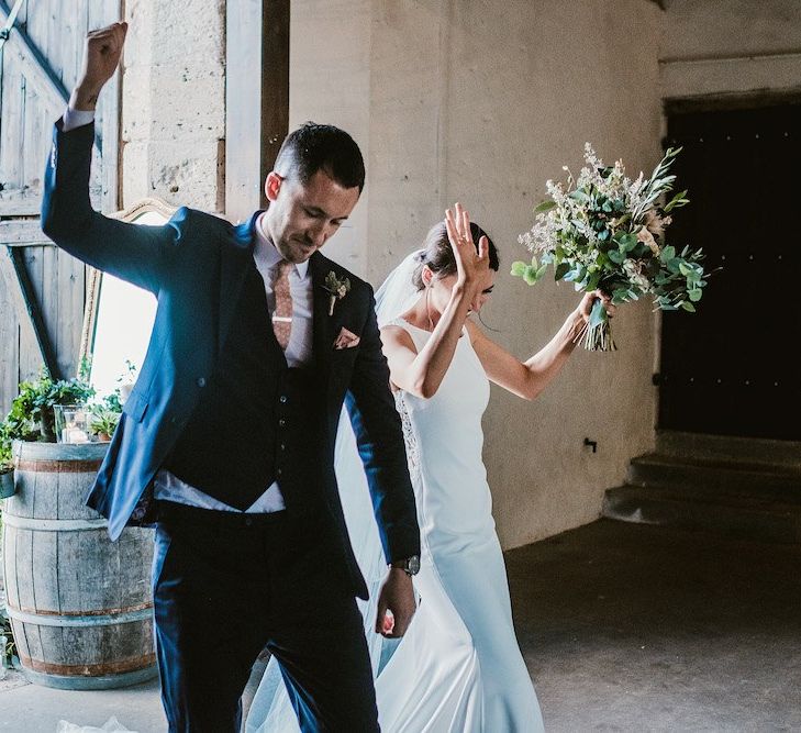 Bride and groom enter wedding breakfast