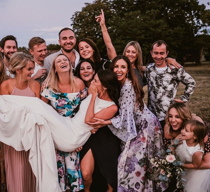 Bride poses with guests