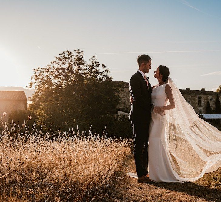 Bride in long veil at Chateau Rigaud