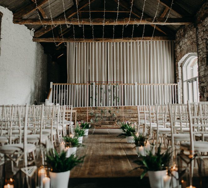 Askhal Hall ceremony setup with plants and candles