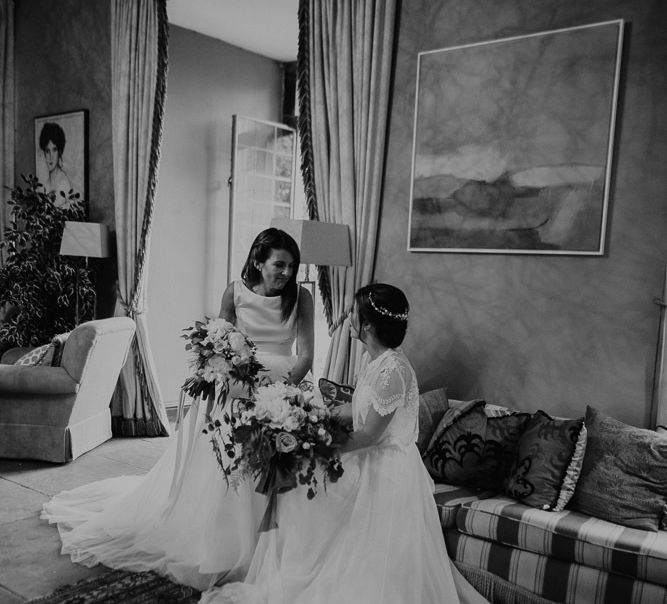 Black and white portrait of two brides