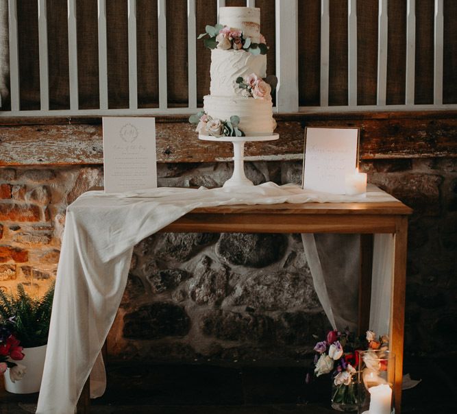 Cake table with three tier buttercream  cake