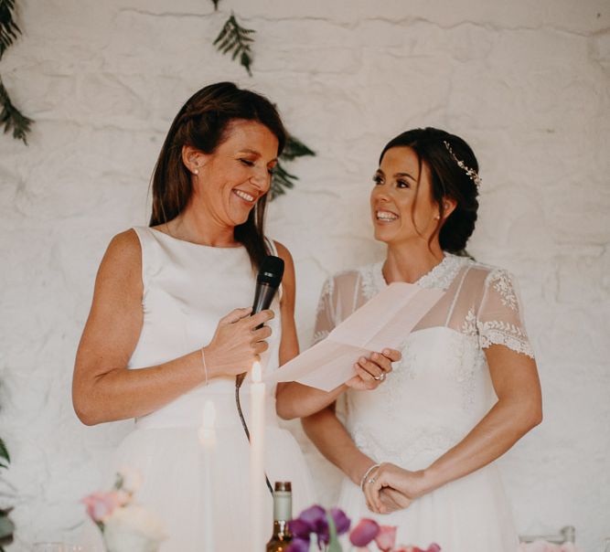 Lesbian wedding with two brides delivering a speech together