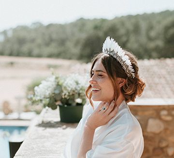 Bride In Feather Headdress With Hair Up For Outdoor Wedding