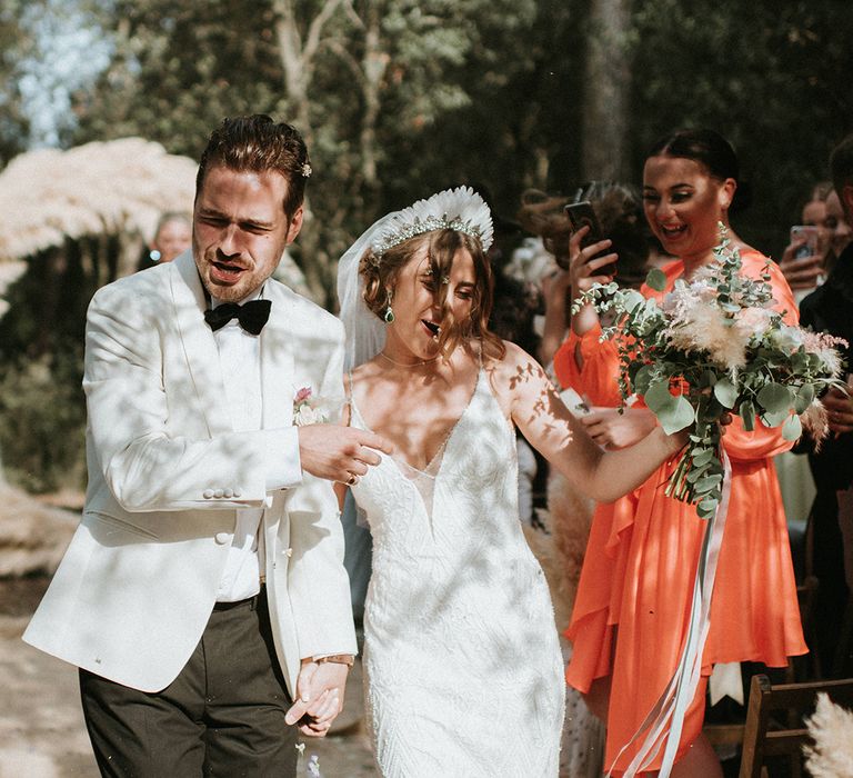 Bride And Groom Walk Up Aisle As Husband And Wife With Pampas Grass Decor