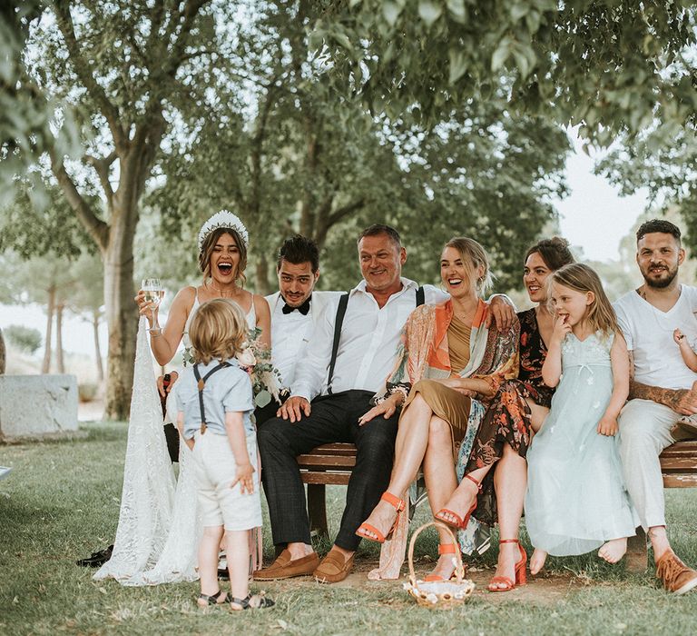 Bride In Feather Headdress With Guests