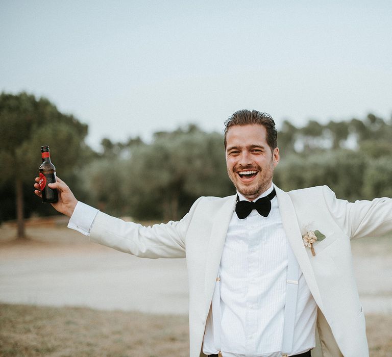 Groom In White Dinner Jacket and Bow Tie