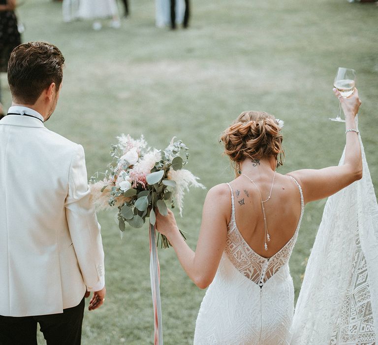 Low Back Wedding Dress With Peony Bouquet