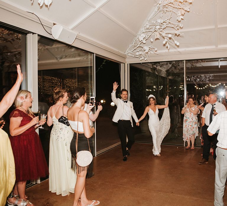 Bride and Groom Enter Room As Husband And Wife