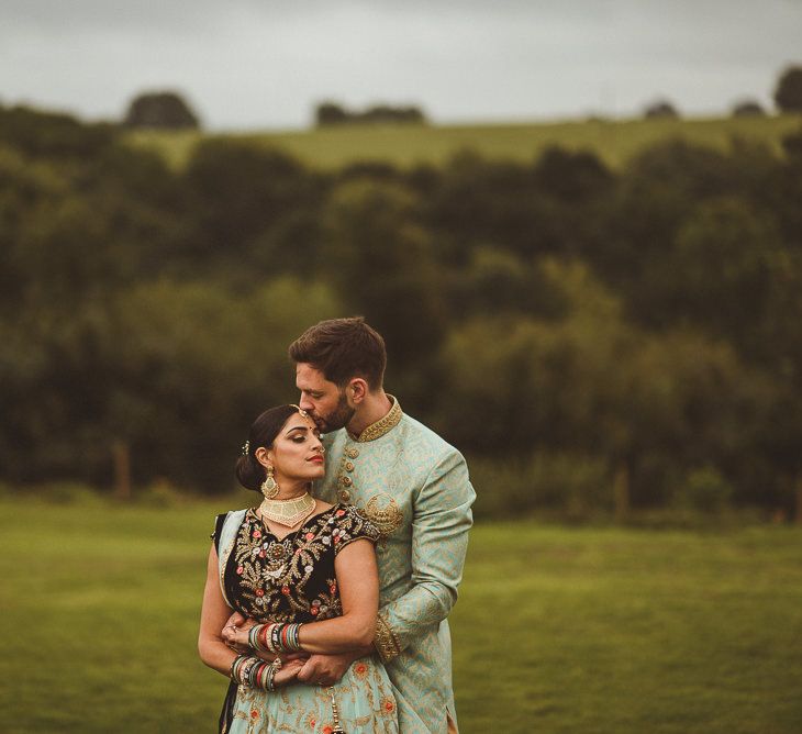 Bride &amp; Groom in Traditional Indian Wedding Attire | Fusion Rustic Indian Country Wedding at The Green Cornwall | Matt Penberthy Photography