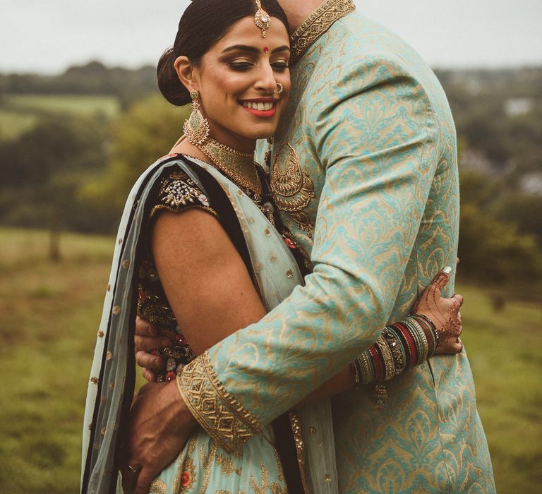 Bride &amp; Groom in Traditional Indian Wedding Attire | Fusion Rustic Indian Country Wedding at The Green Cornwall | Matt Penberthy Photography