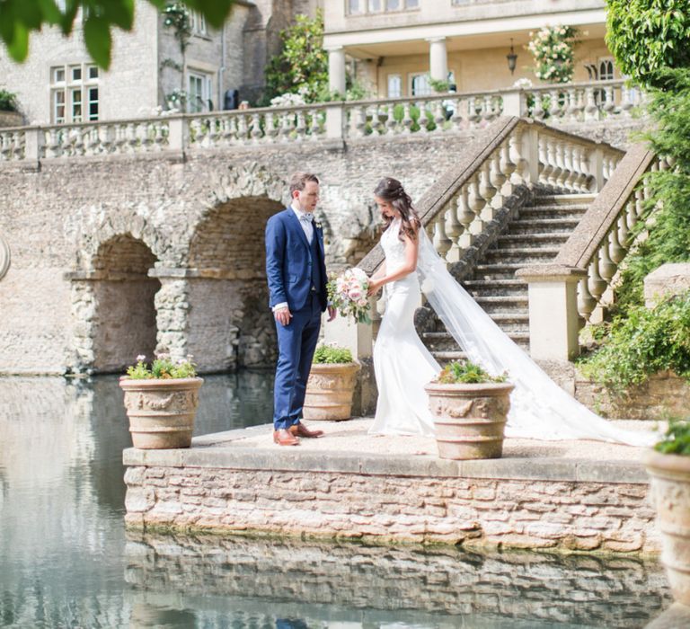 Bride and Groom Standing by the Mote of The Lost Orangery