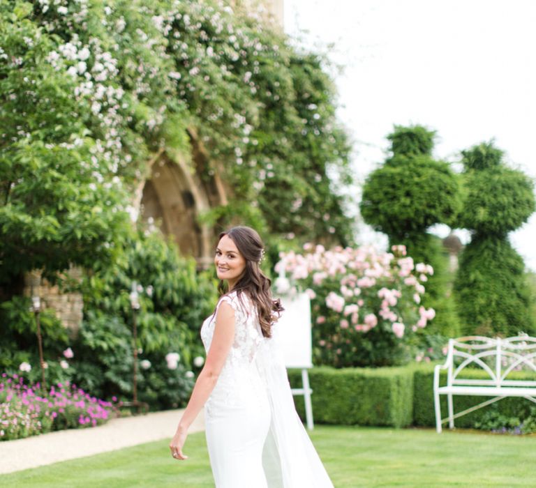 Bride in Lace Wedding Dress and Bridal Cape