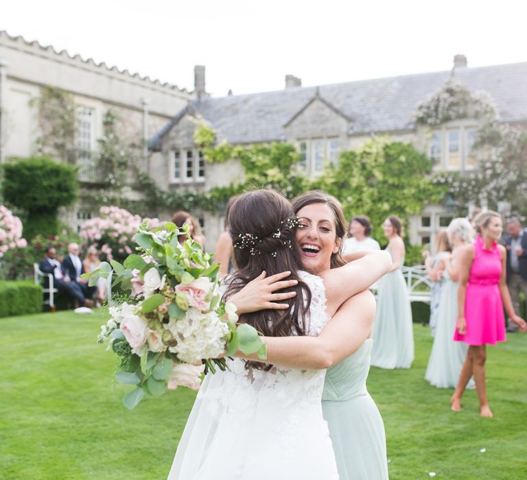 Wedding Guest Hugging The Bride