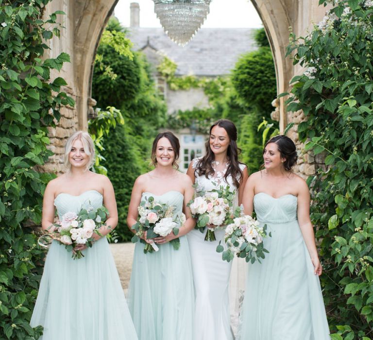 Bridal Party Portrait with Bridesmaids in Pale Green Dresses