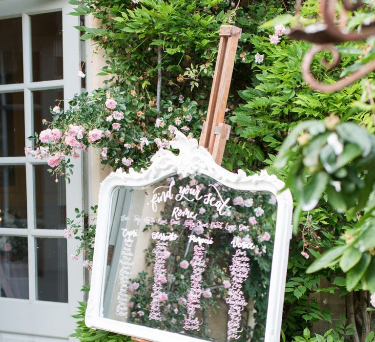 White Ornate Glass Table Plan on an Easel