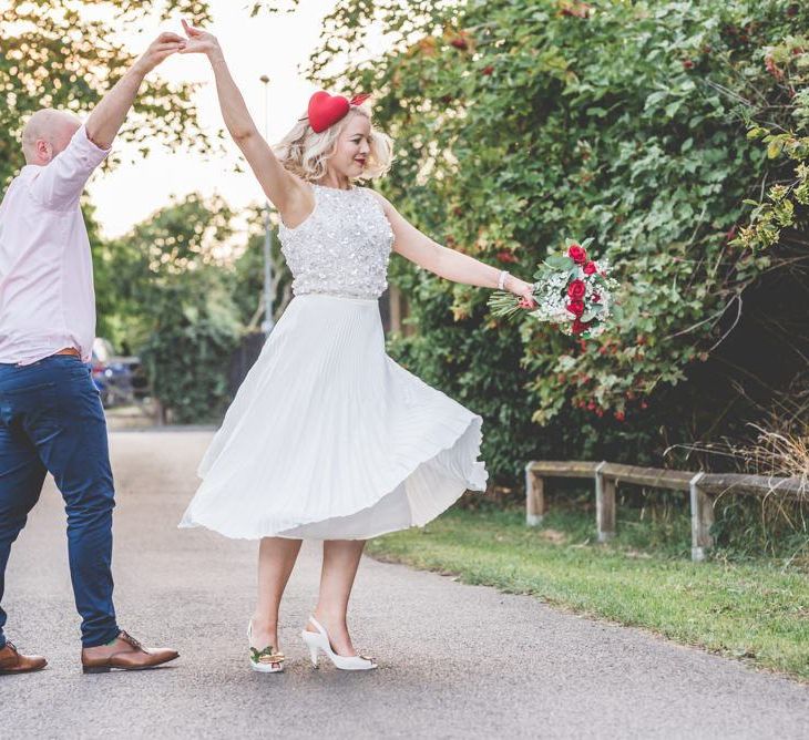 Beautiful two piece gown with pleated midi wedding skirt and bright accessories