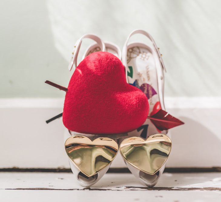 Vivienne Westwood shoes and bright heart hair accessory for fun village fete themed day