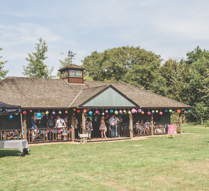 Paper lantern decor at pavilion reception with outdoor bbq food truck