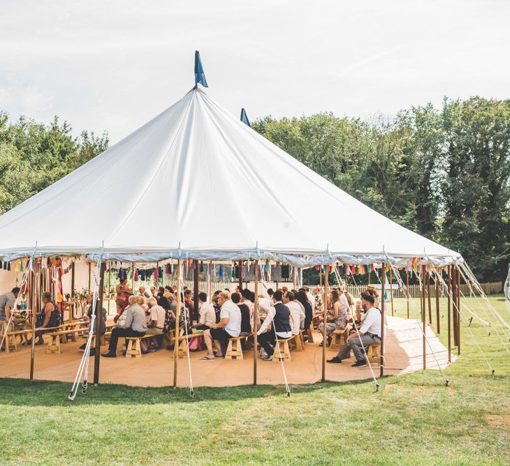 Village fete festival styled marquee reception with bunting and ribbon decoration