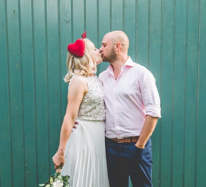 Bride wearing two piece gown with a midi wedding skirt and embellished top