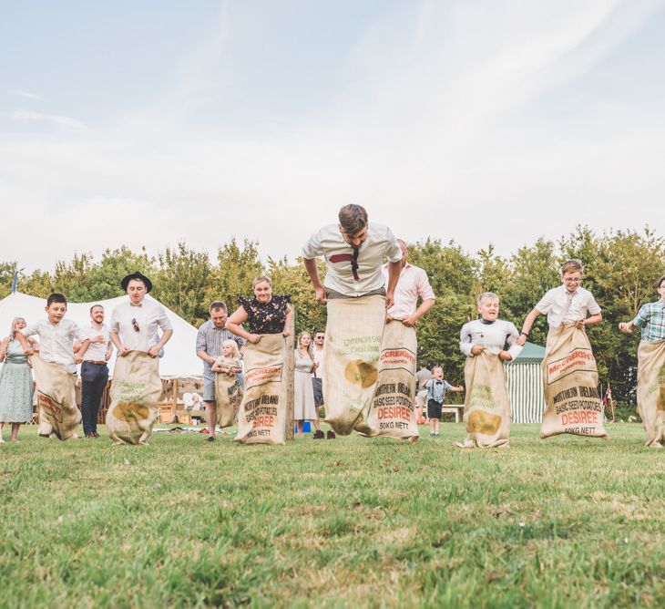 Sack races games at this fun outdoor village fete themed celebration