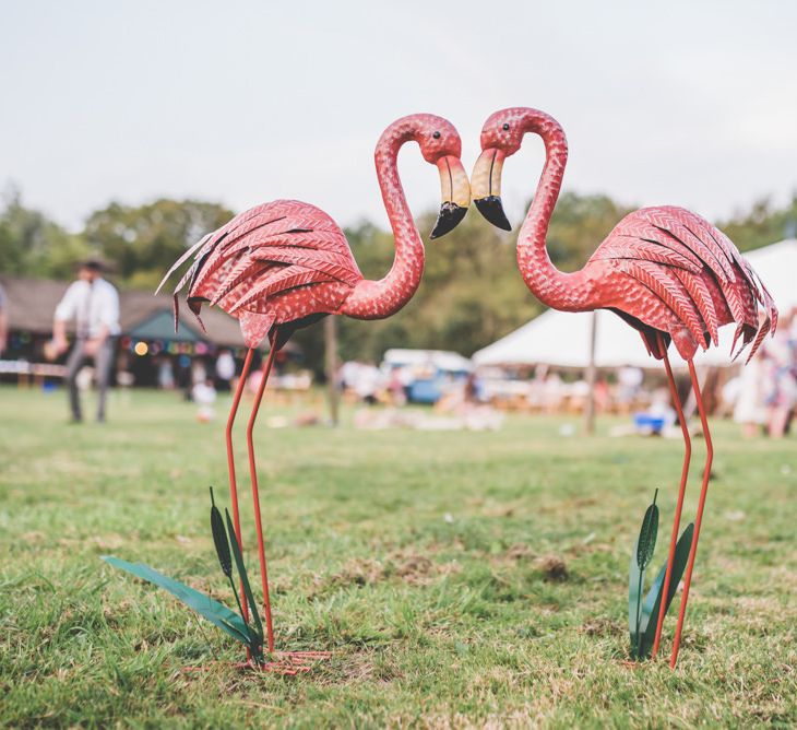 Flamingo decor at this fun and relaxed village fete festival themed celebration